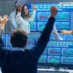 group of traders cheering at stock market
